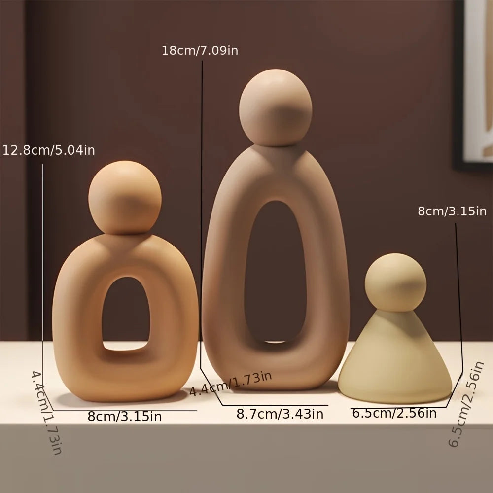 Three ceramic figures with measurements on a brown background