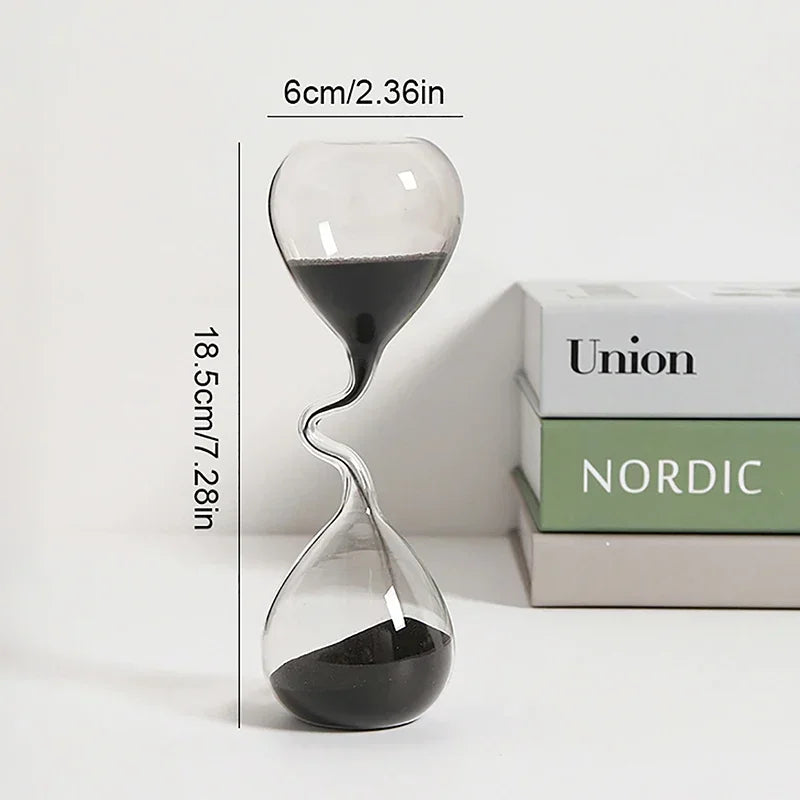 Glass hourglass with measurements and 'Nordic' branding on a white background